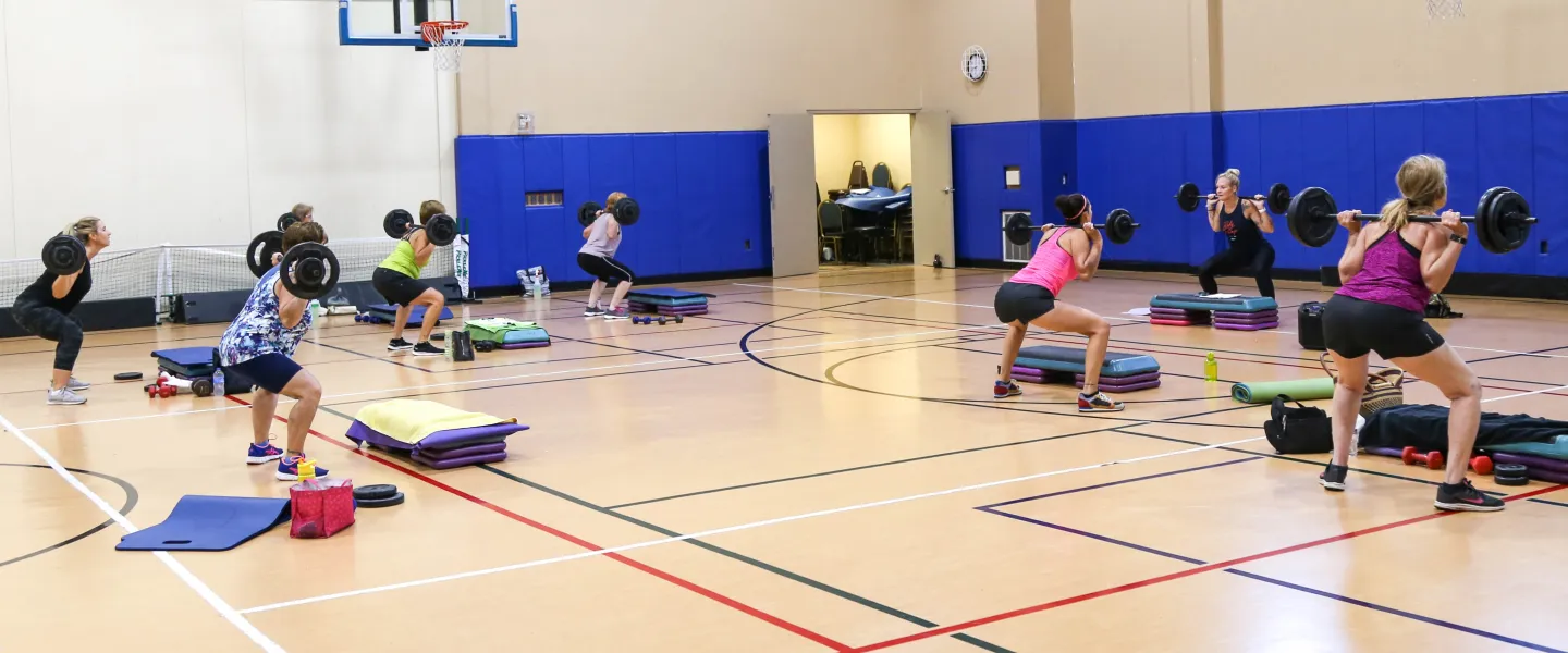 group exercise class in gymnasium