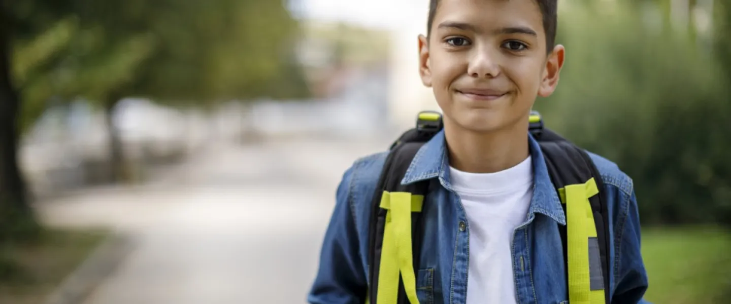 school age boy with backpack