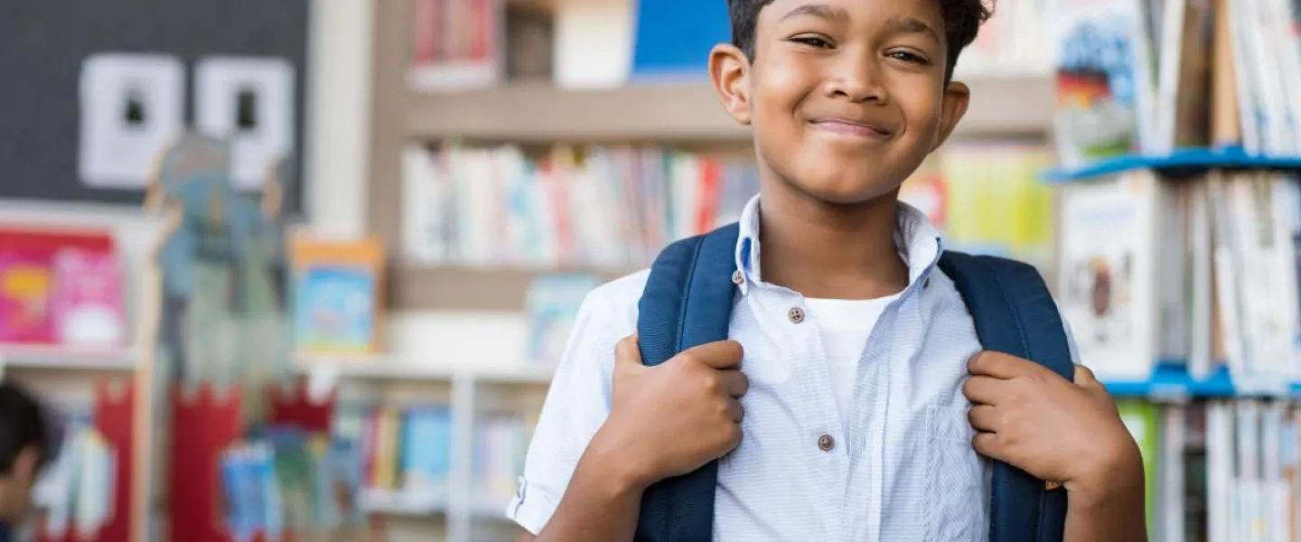 school age boy with backpack