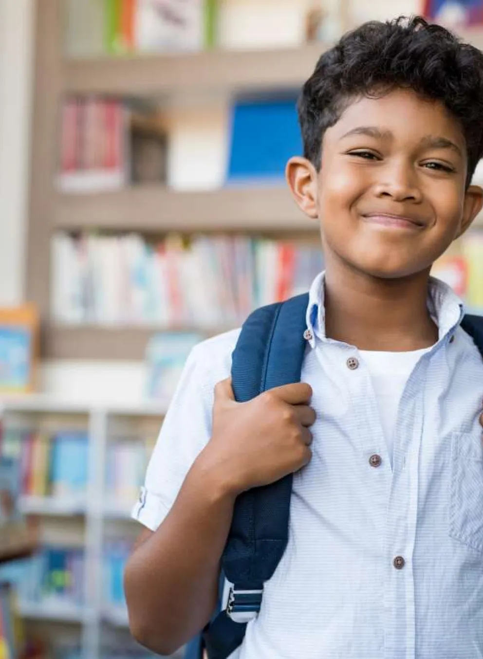 school age boy with backpack
