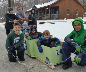 boys posing in carboard train
