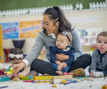 toddlers in classroom with teacher