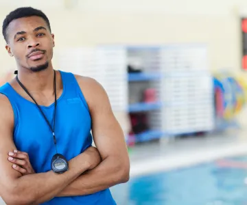 lifeguard in blue shirt on deck