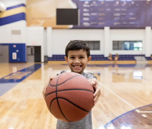 boy holding basketball