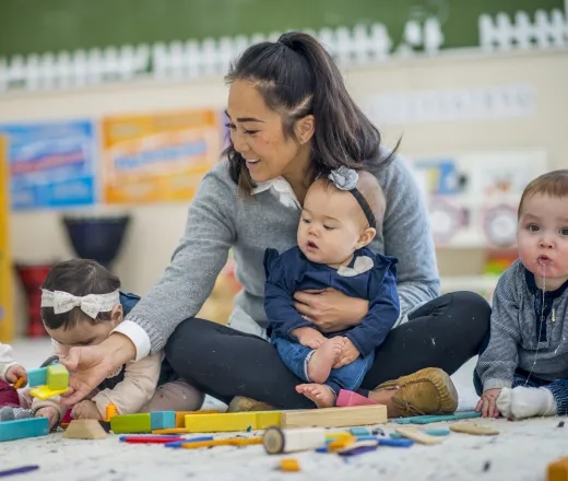 toddlers in classroom with teacher