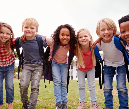 school age children with backpacks