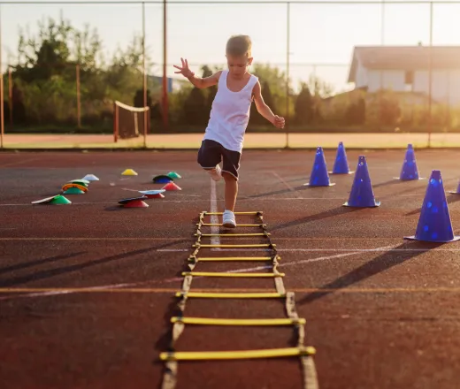 kid running training course ladder