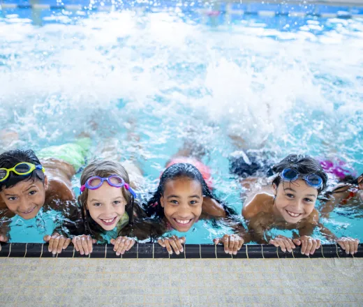 kids lined up in swimming pool