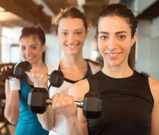 teens holding barbells