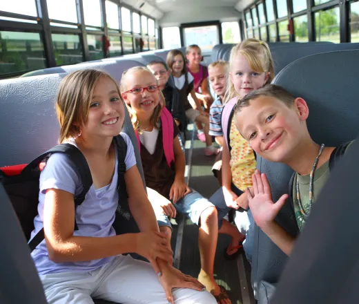 kids on camp bus