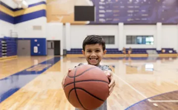 boy holding basketball