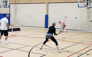 adults playing pickleball